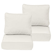 Four beige cushions on a white background